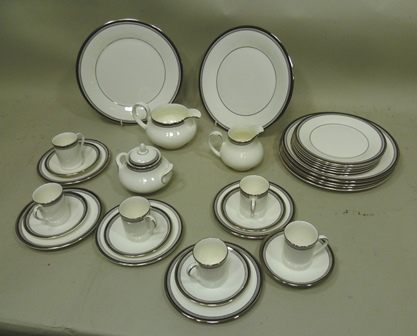 A ROYAL DOULTON BONE CHINA DINNER SET, "Sarabande" pattern, having silvered decoration comprising