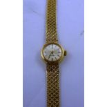 A 9CT GOLD OMEGA LADY'S INTEGRAL BRACELET WATCH having Milanese style plaited bracelet and including