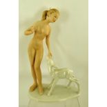 A "WALLENDORF" PORCELAIN FIGURINE, depicting a nude young woman with a fawn, 22cm high