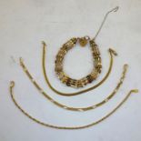 A 9CT. GOLD FOUR-BAR GATE BRACELET, and THREE OTHER CHAIN BRACELETS