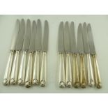 RICHARD COMYNS A MATCHED SET OF TWELVE TABLE KNIVES, Old English and thread pattern silver handles