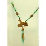 IN THE MANNER OF MAX NEIGER An Egyptian Revival necklace with apple green glass beads, scarabs and