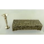 A WHITE METAL TOOLED AND WORKED RECTANGULAR BOX having hinged lid, all over worked with leaf