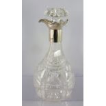 W. & C. SISSONS A SILVER MOUNTED CUT GLASS DECANTER with triple pouring lips and mushroom stopper,