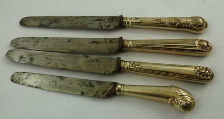 AN ASSORTMENT OF FOUR GEORGIAN/VICTORIAN SILVER BANDED TABLE KNIVES Queens pattern, flute and