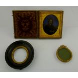 A 19TH CENTURY CASED DAGUERROTYPE PHOTOGRAPH depicting a portrait of a lady, hand tinted and gilded,