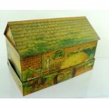 A "HUNTLEY & PALMER" BISCUIT TIN IN THE FORM OF A FARM, with fold-away gated wall, printed with