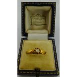 AN EARLY 20TH CENTURY DIAMOND SOLITAIRE having old cushion cut brilliant in fancy claw setting