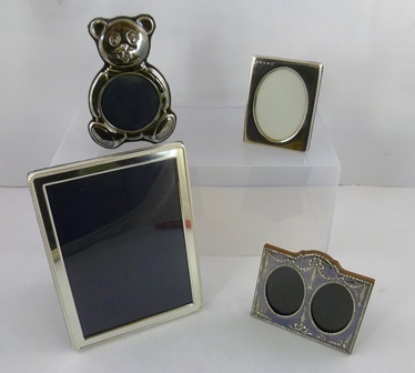 THREE STERLING SILVER PHOTOGRAPH FRAMES comprising; one rectangular Sheffield 1998 20.5 x 15.5cm,