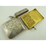 J** W** A GEORGIAN SILVER VINAIGRETTE fashioned as a satchel with tooled exterior and gilded