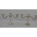 DEAKIN AND FRANCIS LTD. A PAIR OF SILVER TWIN BRANCH CANDELABRUM having hexagonal sconces, on