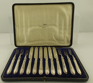 A CASED SET OF "WALKER AND HALL" SILVER PLATED DESSERT KNIVES AND FORKS for six place settings