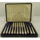 A CASED SET OF "WALKER AND HALL" SILVER PLATED DESSERT KNIVES AND FORKS for six place settings