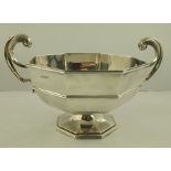 WALKER AND HALL AN OCTAGONAL SILVER FRUIT BOWL with scroll handles, raised on platform base,