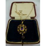 A LATE VICTORIAN/EDWARDIAN AMETHYST AND SEED PEARL GOLD PENDANT having oval mixed cut stone with