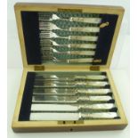 A SET OF DESSERT KNIVES AND FORKS FOR SIX having silver plated blades with mother of pearl