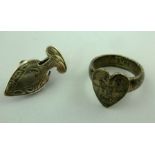 AN EDWARDIAN SILVER NAPKIN CLIP, having chased decoration, Chester 1904, 2.5cm, together with a