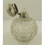 J. COLLYER LTD. A SILVER CAPPED SCENT BOTTLE having scrolled pressed decorated mushroom cap with