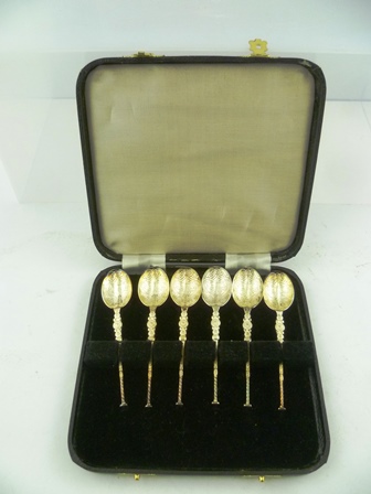 A SET OF SIX SILVER COFFEE SPOONS of early anointing spoon design, chased and cast decoration,