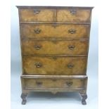A GEORGE II DESIGN WALNUT VENEER CHEST ON STAND, the top fitted two short drawers over three long