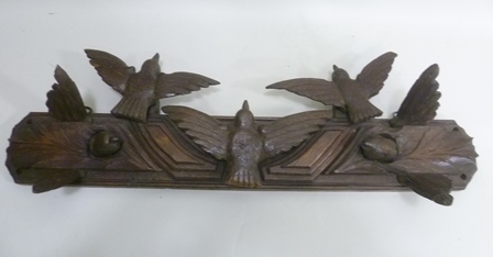 A BLACK FOREST CARVED OAK WALL BRACKET with birds in flight decoration, c1890, 74cm wide
