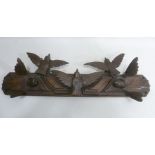 A BLACK FOREST CARVED OAK WALL BRACKET with birds in flight decoration, c1890, 74cm wide