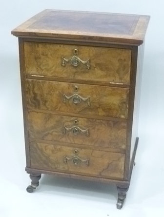 AN EMPIRE PERIOD FRENCH WALNUT CABINET having tooled leather insert top, four drawer frontage the
