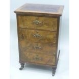 AN EMPIRE PERIOD FRENCH WALNUT CABINET having tooled leather insert top, four drawer frontage the