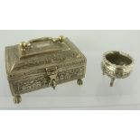 AN EASTERN WHITE METAL CASKET with chased landscape decoration, having hinged cover with swan neck