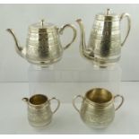 AN EDWARDIAN SILVER PLATED FOUR-PIECE TEA AND COFFEE SERVICE, having chased decoration, comprising a