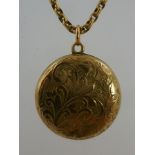 AN EARLY 20TH CENTURY GOLD BACK AND FRONT LOCKET, three section with engraved decoration on period