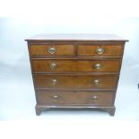 A GEORGE III OAK CHEST OF DRAWERS the carcase mahogany cross banded, fitted with two short over