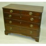 A GEORGE III MAHOGANY CHEST OF TWO SHORT OVER THREE LONG GRADUATED DRAWERS replacement oval brass