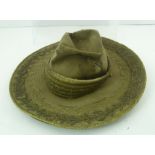 A LATE 19TH CENTURY MEXICAN CHARRO HAT, having broad rim with decorative wire work embroidery to the