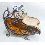 A 19TH CENTURY RIVETED COPPER PURDONIUM in wrought iron framed stand, with open spiral twist handle,