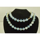 A SUBSTANTIAL FACETTED OPAL GLASS BEAD NECKLACE with bolt ring clasp, 78cm long