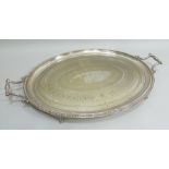 A LARGE GEORGIAN DESIGN SILVER PLATED TEA TRAY, oval with beaded rim and chased decoration, fitted