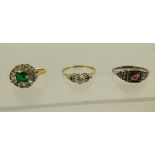 A SELECTION OF THREE STONE SET DRESS RINGS comprising; a Victorian red stone set silver dress