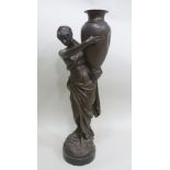 A LATE 19TH CENTURY FRENCH BRONZE FEMALE FIGURE depicting a water carrier in classical costume,