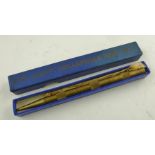 A "NORTHWOOD" COLLAPSIBLE BRASS DART SET fashioned as a pencil with knurled body in blue, in