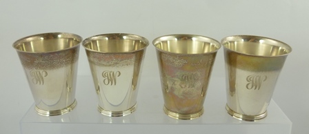 SPINK & SON A SET OF FOUR PLAIN CONICAL SILVER GOBLETS, each monogrammed "J.W." with heavy wire