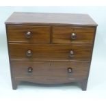 A 19TH CENTURY MAHOGANY CHEST OF FOUR DRAWERS, comprising two short over two long, oak lined with