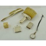 TWO SILVER CRUMB BRUSHES, a plain silver VESTA CASE, an engraved silver MATCH SLIDE, an early 20th