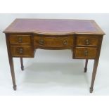 A LATE VICTORIAN MAHOGANY SIDE OR WRITING TABLE, having tooled leather top with bow central section,