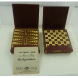 TWO EARLY 20TH CENTURY BOXED PORTABLE GAMES BY E S LOWE, chess and backgammon in morocco red