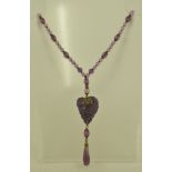 AN ART DECO AMETHYST COLOURED BEAD NECKLACE, 60cm long