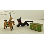 A SELECTION OF TOYS comprising a tin-plate CLOCKWORK LASSO'ING COWBOY ON HORSEBACK, a segmented