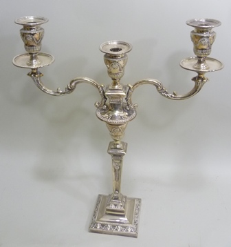 A SILVER PLATED CANDELABRA OF ADAM DESIGN, having three swagged urn sconces on two branches, this