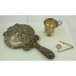 AN EDWARDIAN ART NOUVEAU DESIGN HAND VANITY MIRROR with embossed lily decoration amidst scrolling