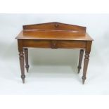 A 19TH CENTURY MAHOGANY SIDE TABLE the gallery back with inset turned roundel in the Egyptian